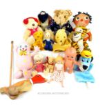 A collection of vintage soft toys and dolls