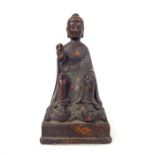 A bronzed cast metal seated Buddha; 23cm high.