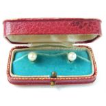 A pair of 9 ct yellow gold and cultured pearl collar studs in original red leather box