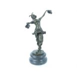 A bronzed metal figurine of an Art Deco style dancing girl, raised upon a marble base; 38cm high.