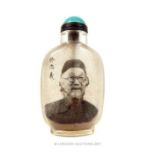 A Chinese glass snuff bottle with image of an elderly Oriental gentleman, with a turquoise