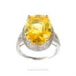 A spectacular, 18 ct white gold, yellow topaz and diamond dress ring