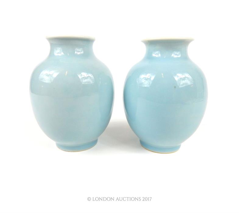 A pair of 19th century, Chinese, clair-de-lune glazed, baluster vases