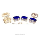 A set of four hallmarked sterling silver mustards and salts, assayed in London in 1919, made by