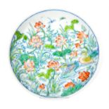 A Chinese porcelain dish, hand painted in the doucai palette with ducks swimming between lilies