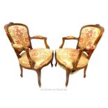 A pair of 19th century, beech framed fauteuils; upholstery a/f.