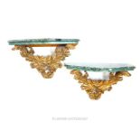 A pair of 19th / 20th century carved giltwood acanthus console brackets