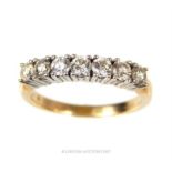 A fine, 9 ct yellow gold, seven stone, diamond ring