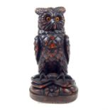 A Black Forest style carved owl container with glass eyes (owls head hinged and acts as a lid); 30cm