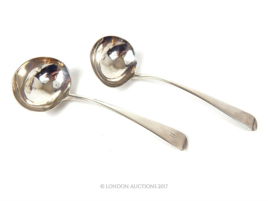 A pair of William IV hallmarked sterling silver sauce ladles, assayed in London in 1835