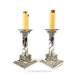 A pair of early 20th century silver plated Neo-Rococo candlesticks converted to table lamps