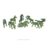 Eight, early 20th century, Chinese, finely-carved, spinach jade (lucky) horses