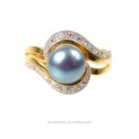 An 18 ct yellow gold, dark grey freshwater pearl and diamond dress ring