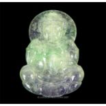 A Chinese jade carved pendant depicting Guan Yin seated on a lotus base
