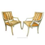 A pair of Regency design grey painted and distressed open armchairs
