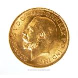 A 1915 full sovereign, 2.1cm diameter, 8.2g (0.26 t oz).