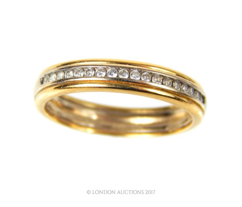 An 18 ct yellow gold and diamond half-set eternity band