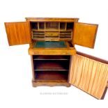 A compact Victorian walnut veneer, bureau with music cabinet below, decorated with boxwood inlays;