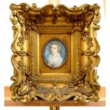 A late 18th century oval miniature portrait of a beautiful young woman