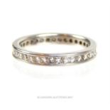 A boxed, platinum and diamond set eternity band