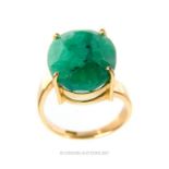 A striking, 18 ct yellow gold and natural, untreated 11 carat, emerald dress ring