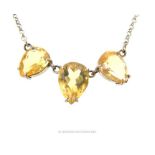 A sterling silver and large, three-stone, citrine necklace