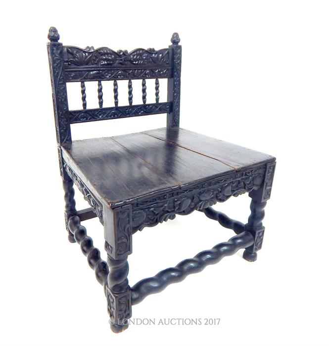 A late 17th Century Colonial Dutch East Indies Carved Ebony Chair, from Batavia or Sri Lanka