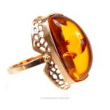 A fine, 15 ct rose gold and large amber cocktail ring
