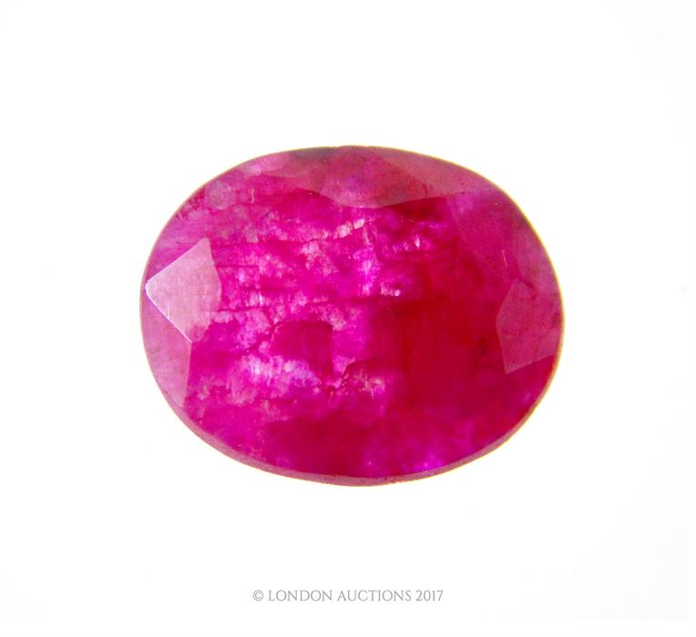 A 10.2 carat natural, oval shaped, faceted pink ruby with eye-visible inclusions (loose stone)