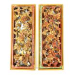 A pair of Chinese gilt wood wall hanging screens with fragmented mother of pearl borders; one a/f