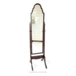 An Edwardian mahogany cheval mirror