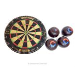 A set of four Jacques 'Eclipse' lawn bowls balls and a darts board