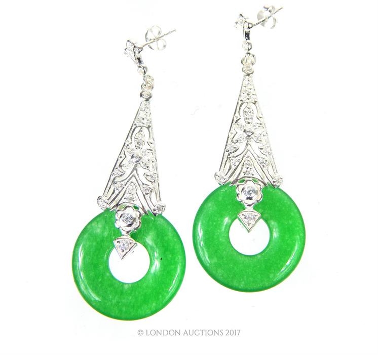 A pair of large silver and jade style drop earrings; stamped 925; 6 cm long.