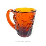 A Scandinavian, (probably Danish), hand-blown, orange glass mug