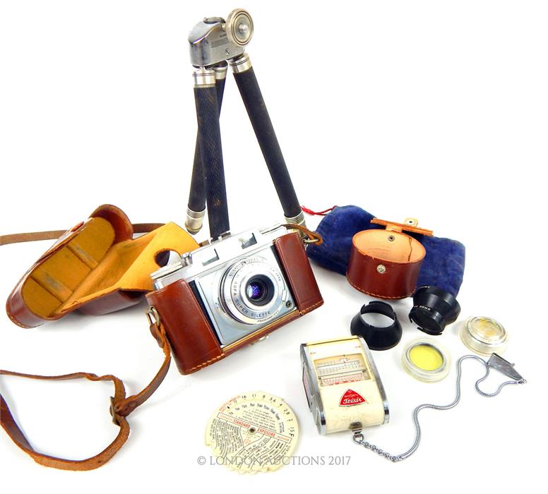 An AGFA Super Silette camera together with various accessories including a Gossen Trisix Color