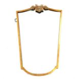 A gilt metal framed shield shaped wall mirror, with stag design mount