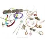 An assortment of white metal, sterling silver and gem-set jewellery
