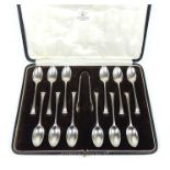 A sterling silver cased set of coffee spoons and sugar tongs by Mappin & Webb