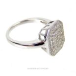 A silver and CZ paneled dress ring; stamped 925.