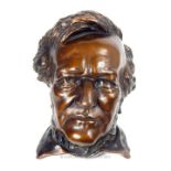 A bronzed ceramic cast bust of Wagner; 30cm long,