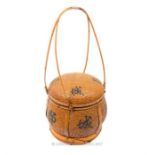 A Chinese woven bamboo lidded food container with twin handles