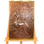 A Continental hand made copper panel depicting a naive peacock