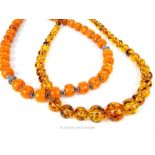 Two long, simulated, amber bead necklaces