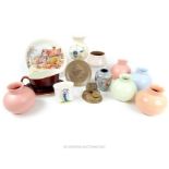 A collection of Poole pottery items including spherical vases in pastel hues