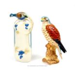 A Beswick Kestral 2316 (17.5cm high) together with an unusual vase with a peacock and berries (