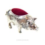 A silver pig pincushion; 4 cm longl.