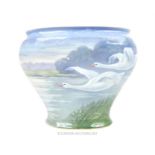 A German Fraureuth Kunstabteilung porcelain vase of ovoid form, decorated with swans