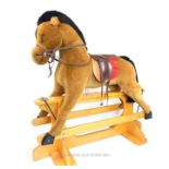 A very large Merrythought Toys rocking horse;157cm high and 155cm long.