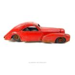 A vintage post war, German red, tin plate, wind up car; 25cm; a/f.