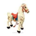 A vintage Mobo tinplate play horse; 76cm high.